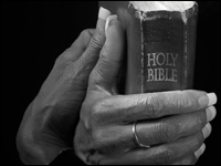 Hands holding Bible
