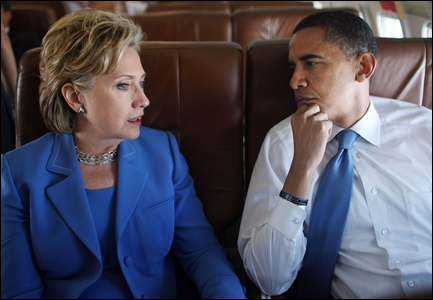 Democratic presidential candidate Sen. Barack Obama (D-IL) and Sen. Hillary Rodham Clinton (D-NY) talk on board Obama's campaign plane