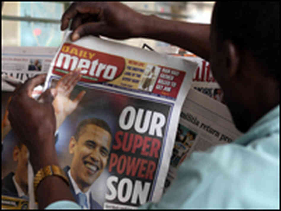 A Kenyan man buys a local newspapers A Kenyan man buys a local newspapers
