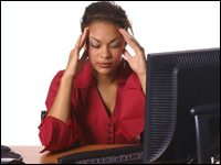 Woman sitting at computer, stressed out