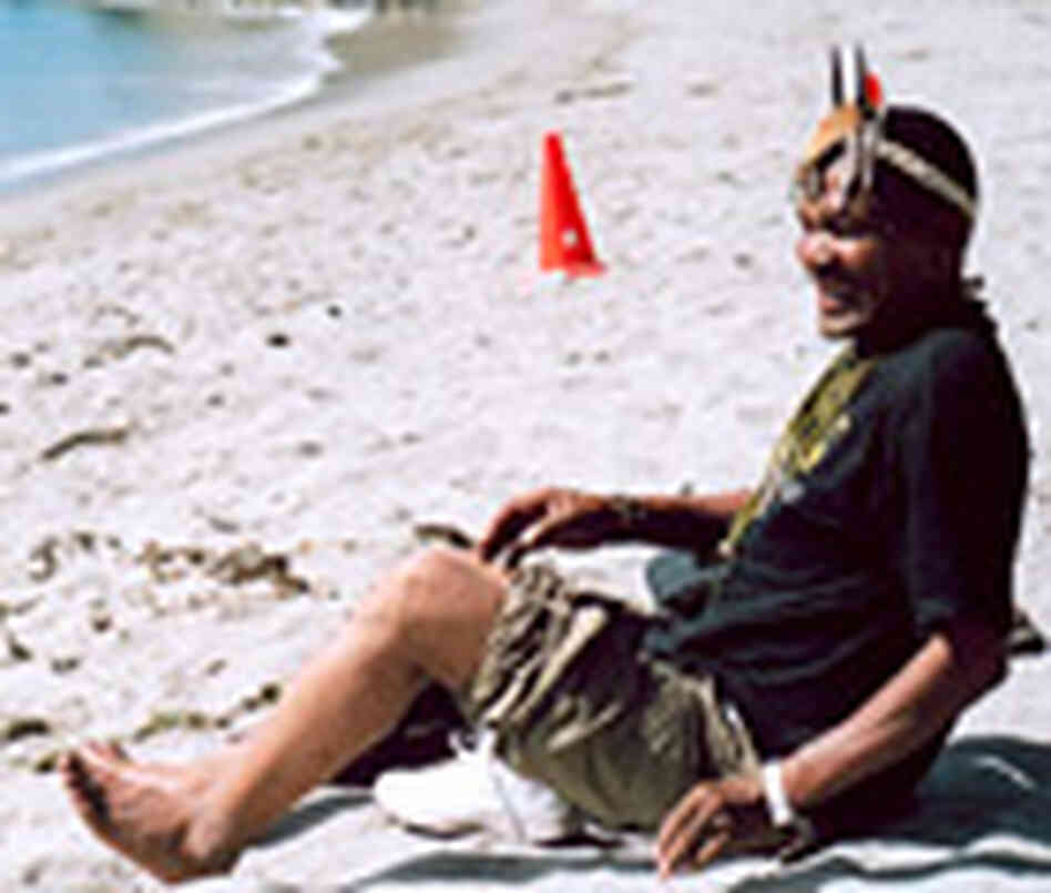 Sesana slips off his shoes on the beach at Paradise Cove in Malibu Sesana slips off his shoes on the beach at Paradise Cove in Malibu