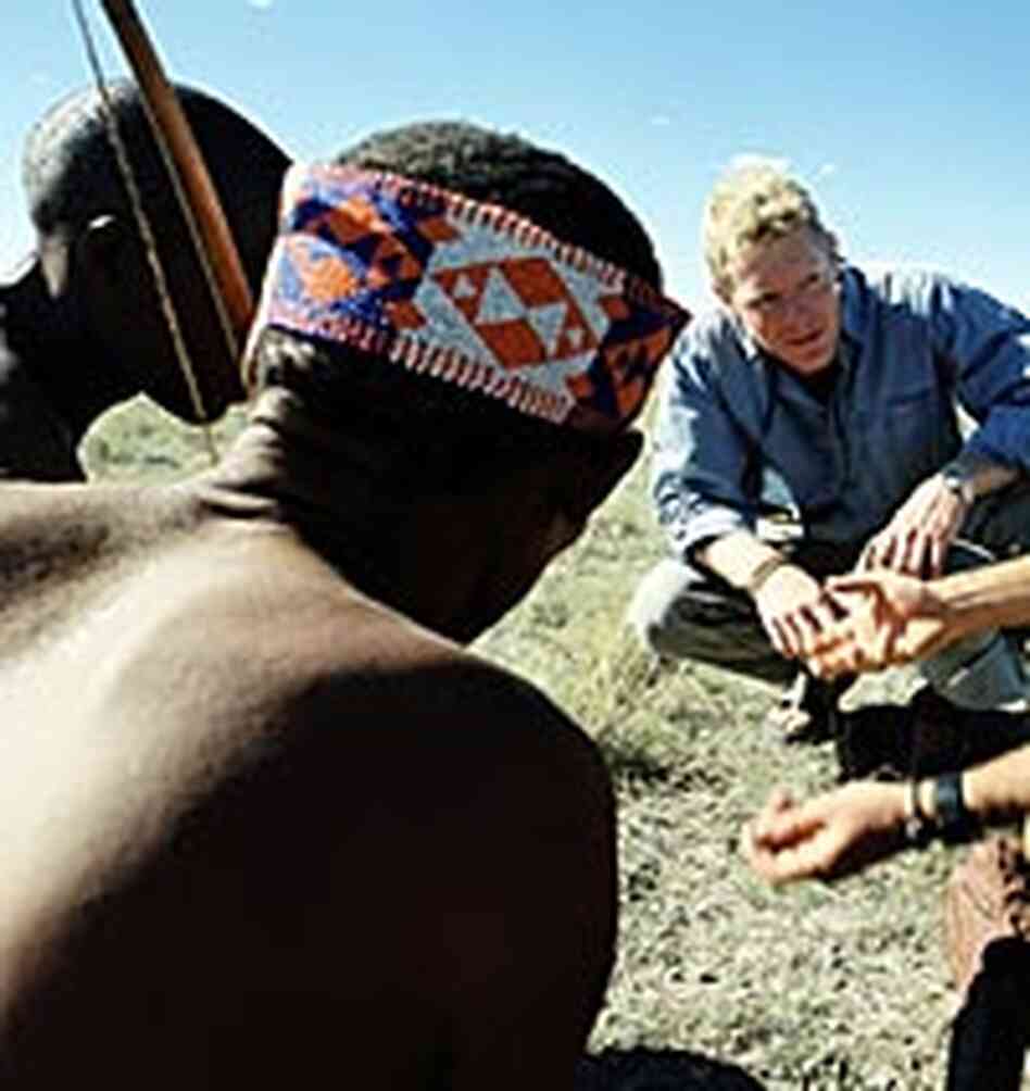 Genetic paleontologist Dr. Spencer Wells in Namibia with San Bushmen.