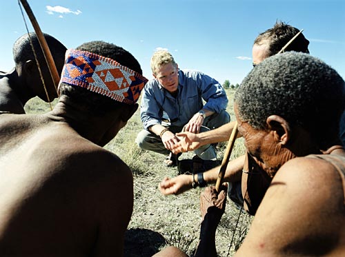 Genetic paleontologist Dr. Spencer Wells in Namibia with San Bushmen.