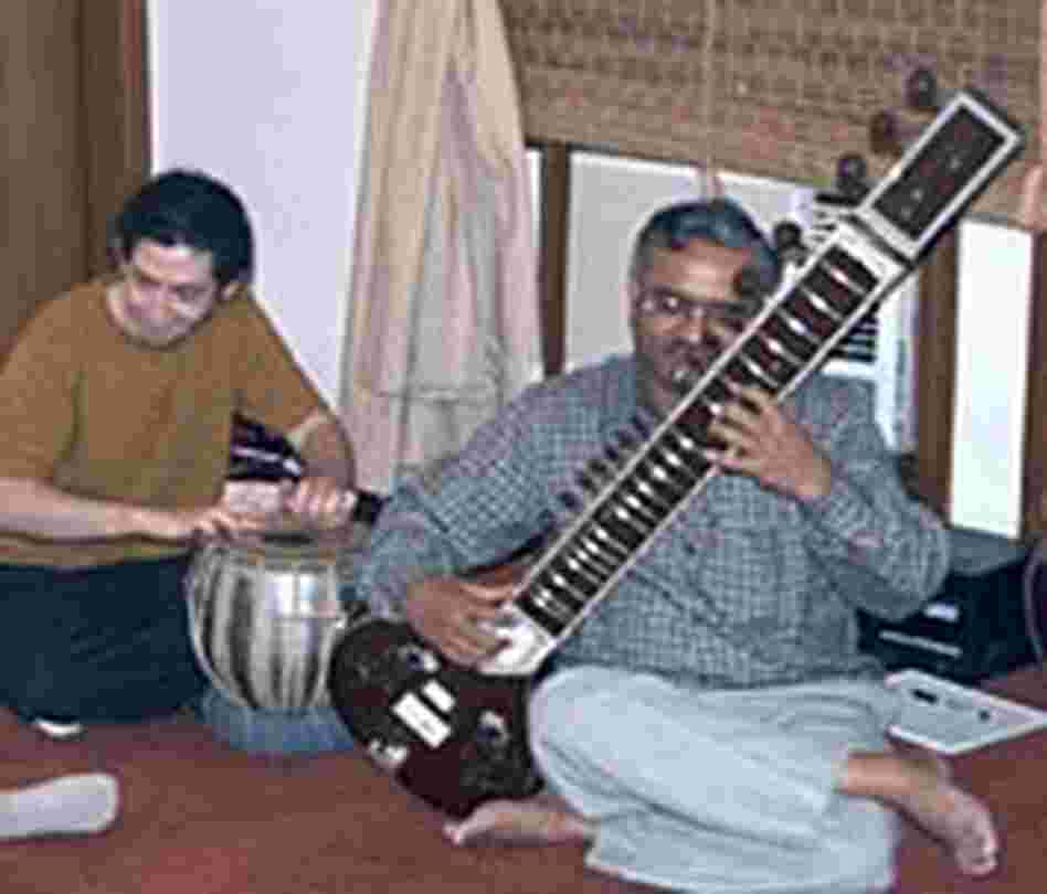 A trio of Shankar's students get a lesson from the master.