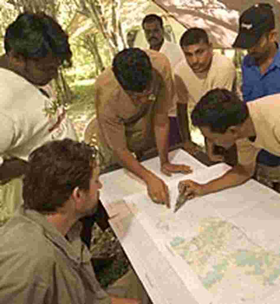 Members of a tsunami ecological damage assessment team Members of a tsunami ecological damage assessment team