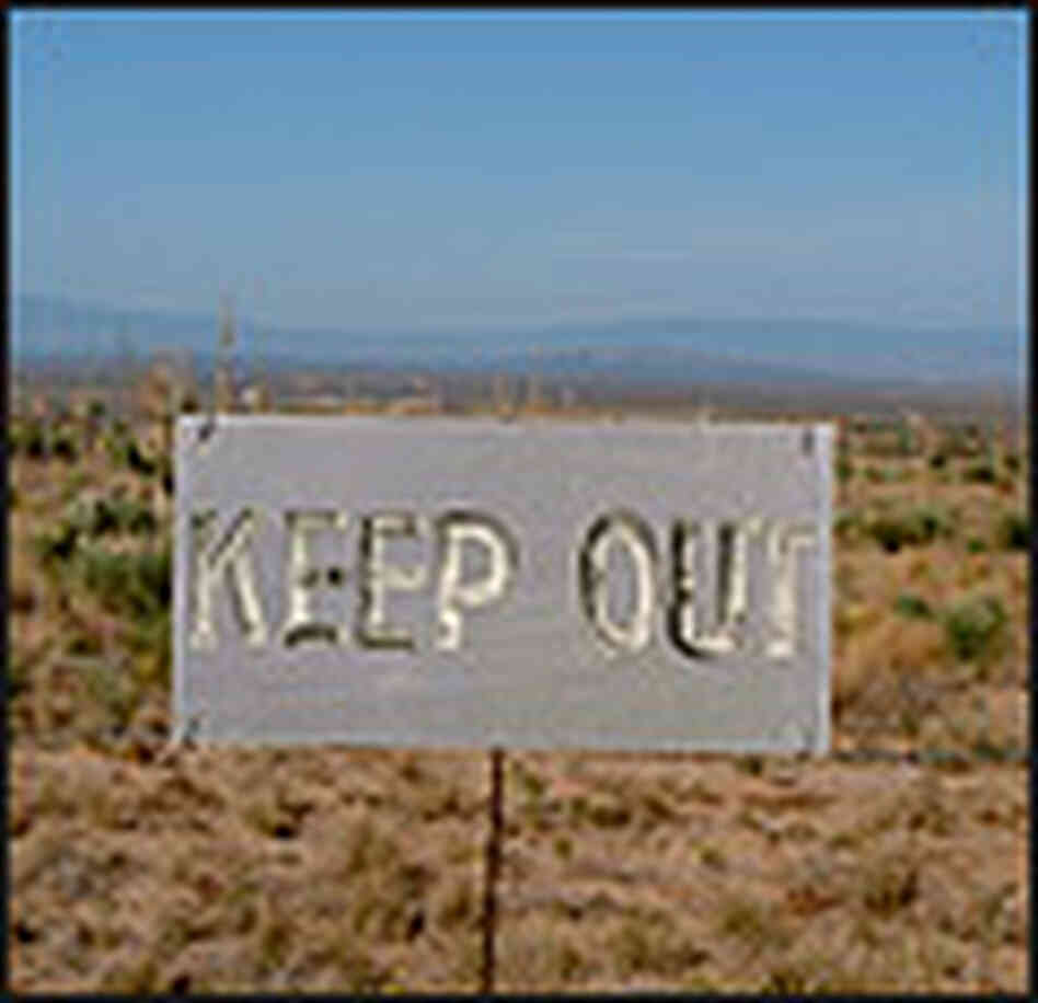 Keep Out sign, with Trinity in the background. Keep Out sign, with Trinity in the background.