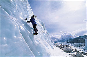 Jamling Norgay swings a pair of ice axes 
		as he scales one of Everest's nearly shear ice walls.