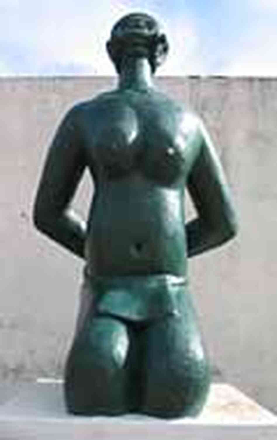 Statue of bound slave woman in Benin slavery memorial Statue of bound slave woman in Benin slavery memorial