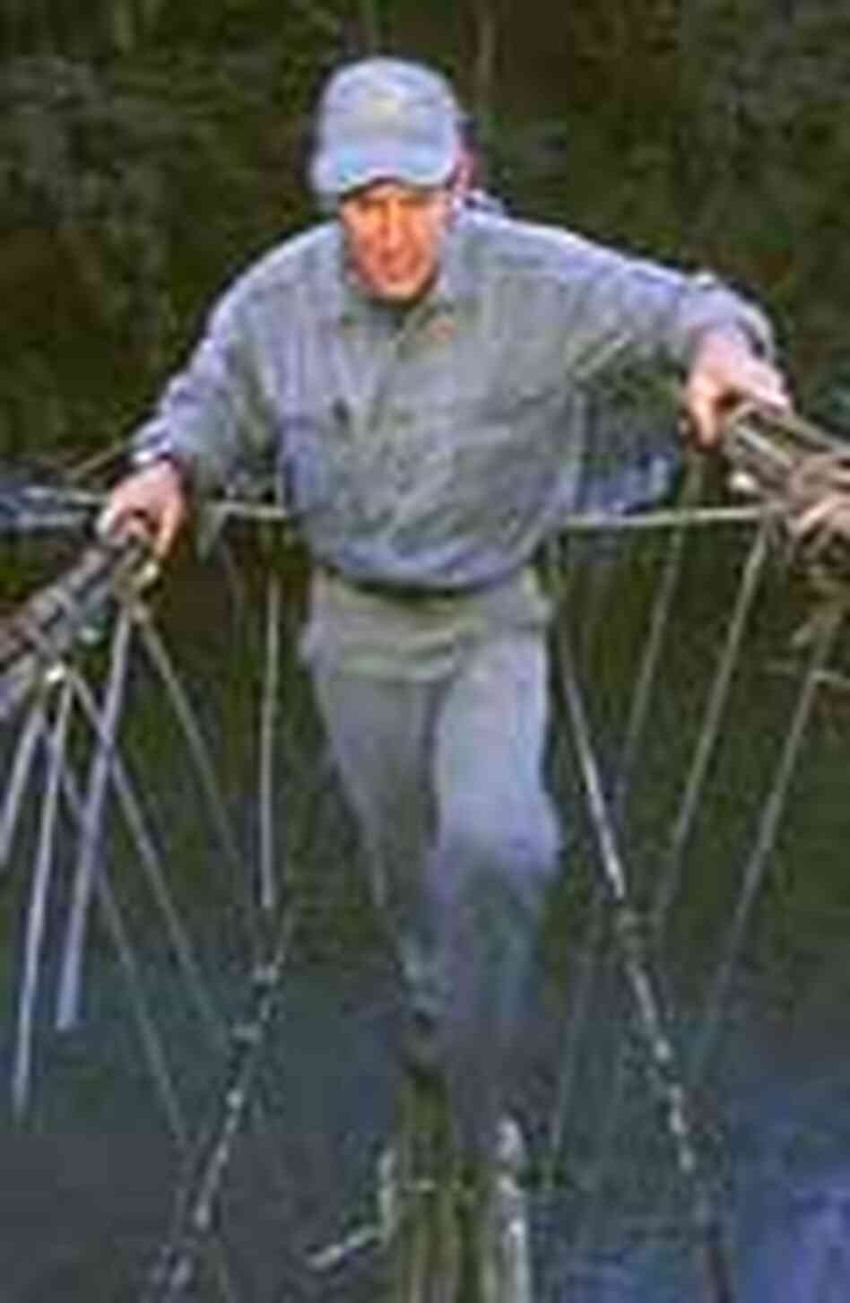 Alan Rabinowitz crosses a rope bridge in northern Myanmar. Alan Rabinowitz crosses a rope bridge in northern Myanmar.