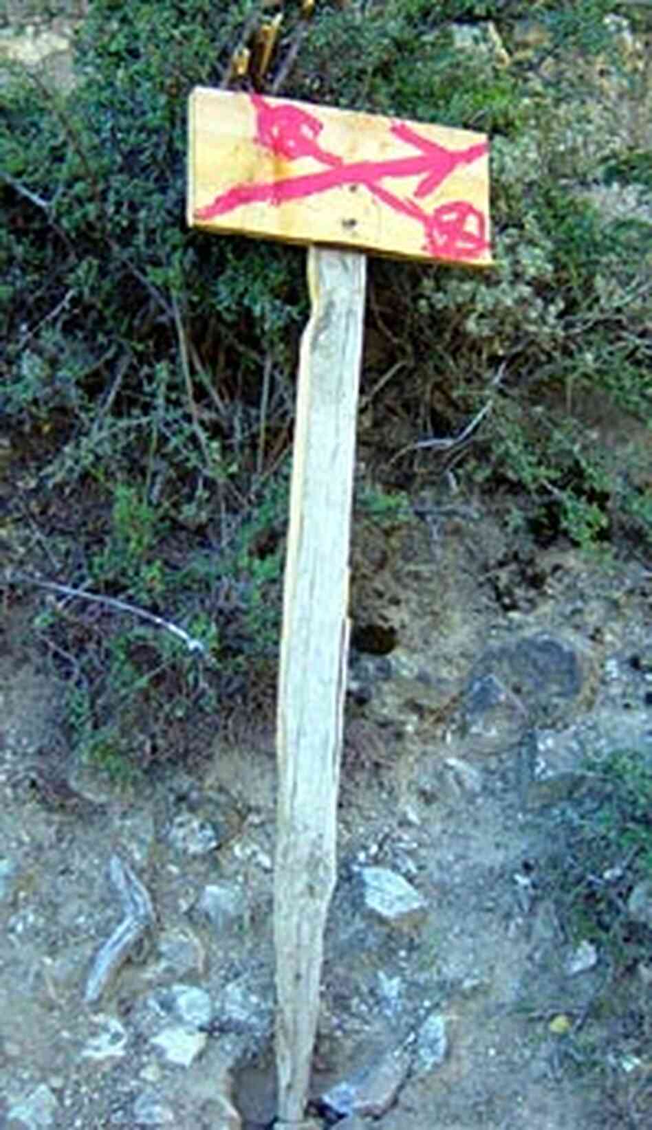 A simple sign points the way to the next destination along the pilgrimage trail. A simple sign points the way to the next destination along the pilgrimage trail.