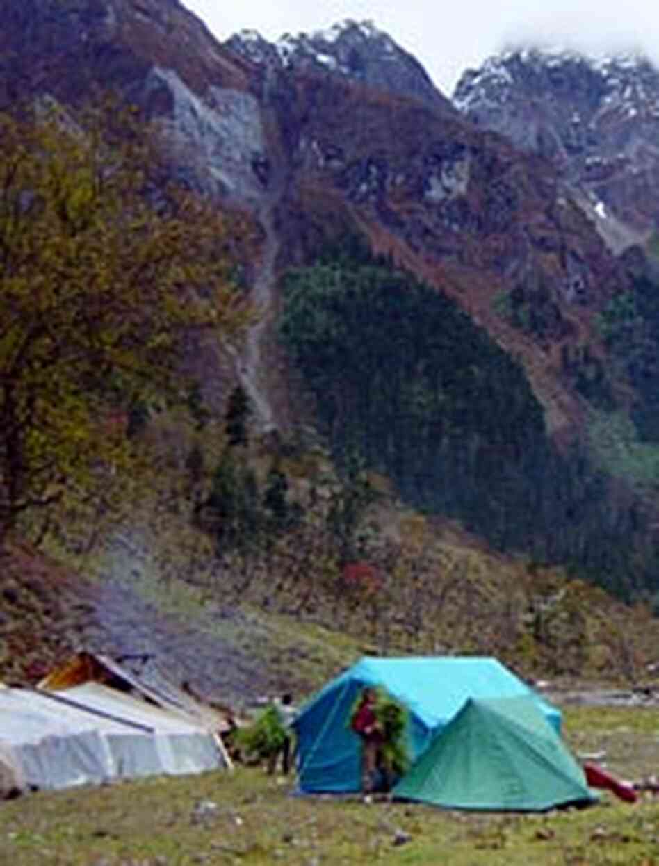 The Zisuthang general store is at left -- just shacks under plastic tarps. Our camp is on the right.