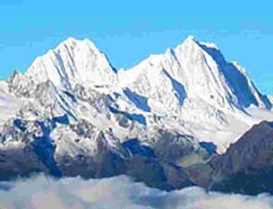 Sunrise view from a very cold Gebula Pass of one of Kawakarpo's sister peaks.