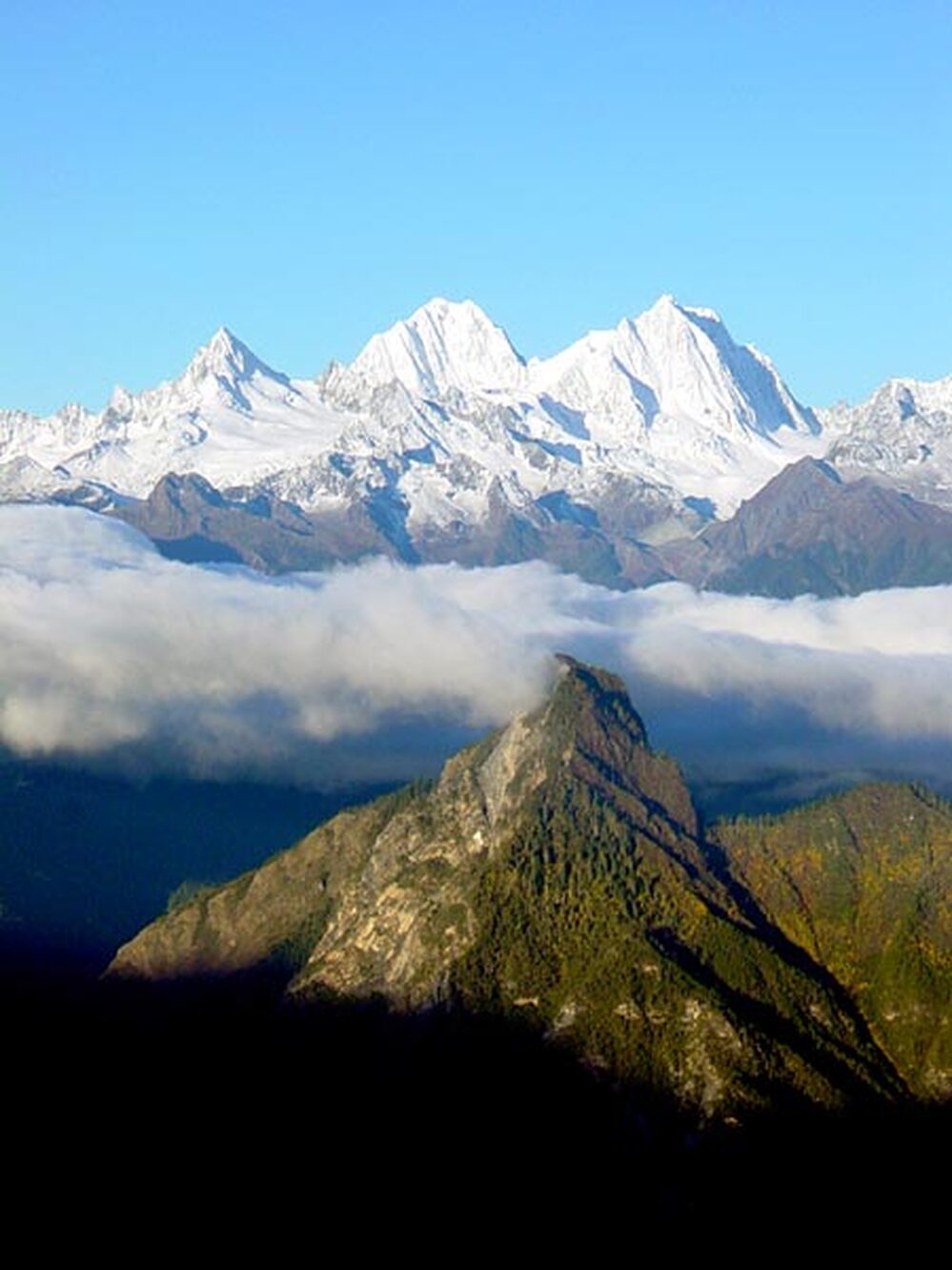 Sunrise view from a very cold Gebula Pass of one of Kawakarpo's sister peaks.
