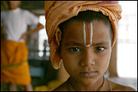 A young devotee of the Hindu god Krishna in Vrindavan, India.