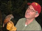 Bruce Beehler studies a female Berlepschi's six-wired bird of paradise Bruce Beehler studies a female Berlepschi's six-wired bird of paradise