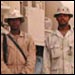 Soliders pose in front of tanker truck in Iraq