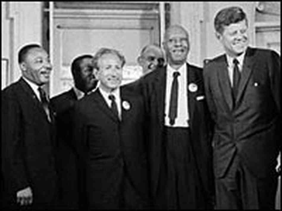 President John F. Kennedy stands with prominent civil rights and labor leaders, including the Rev. M President John F. Kennedy stands with prominent civil rights and labor leaders, including the Rev. M