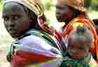 A Sudanese displaced women carries her baby in Abluc village in eastern Chad. A Sudanese displaced women carries her baby in Abluc village in eastern Chad.