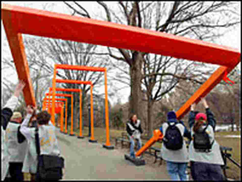 Workers intstall gates art installation in New York's Central Park. Workers intstall gates art installation in New York's Central Park.