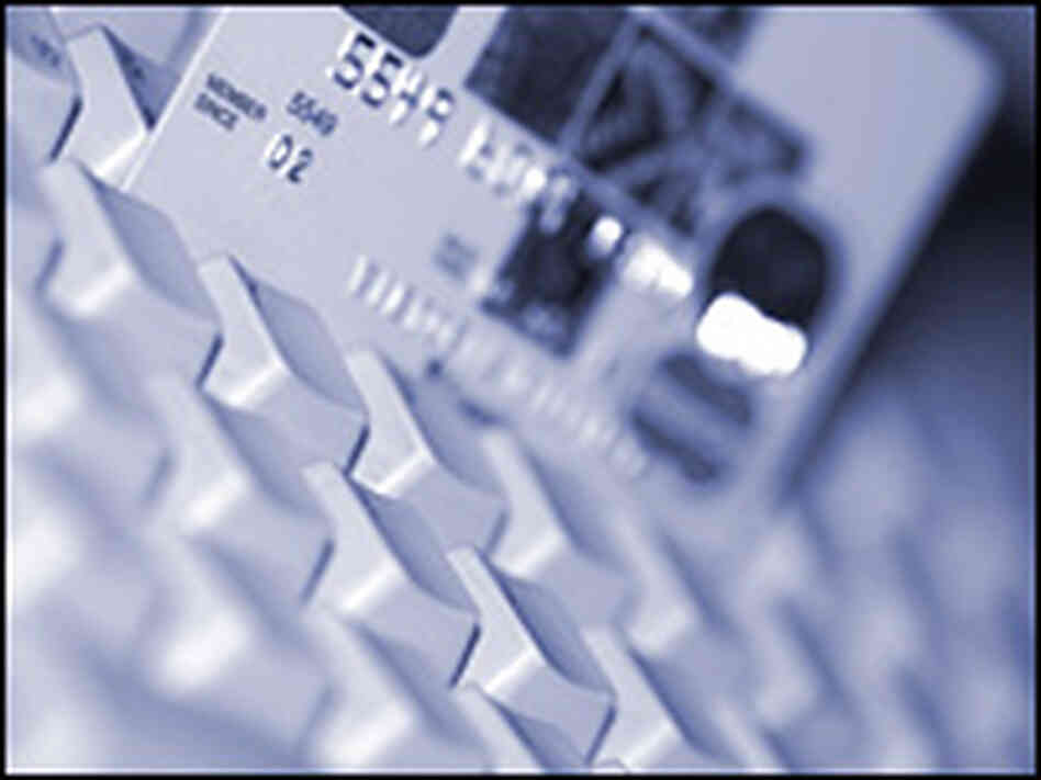 Photo of credit card on keyboard Photo of credit card on keyboard