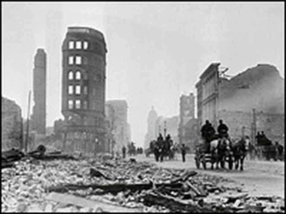 Horse-drawn wagons travel past the rubble of stone buildings on Market Street. Horse-drawn wagons travel past the rubble of stone buildings on Market Street.