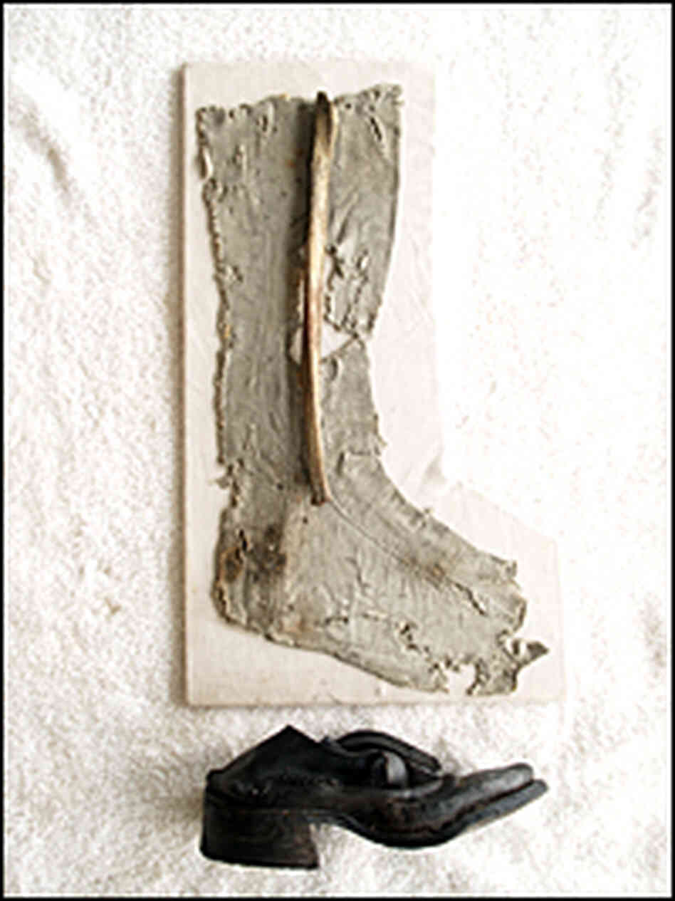 Stocking, fibula, and shoe from the recently identified remains.