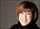 Nora Ephron in a black turtleneck sweater. Nora Ephron in a black turtleneck sweater.
