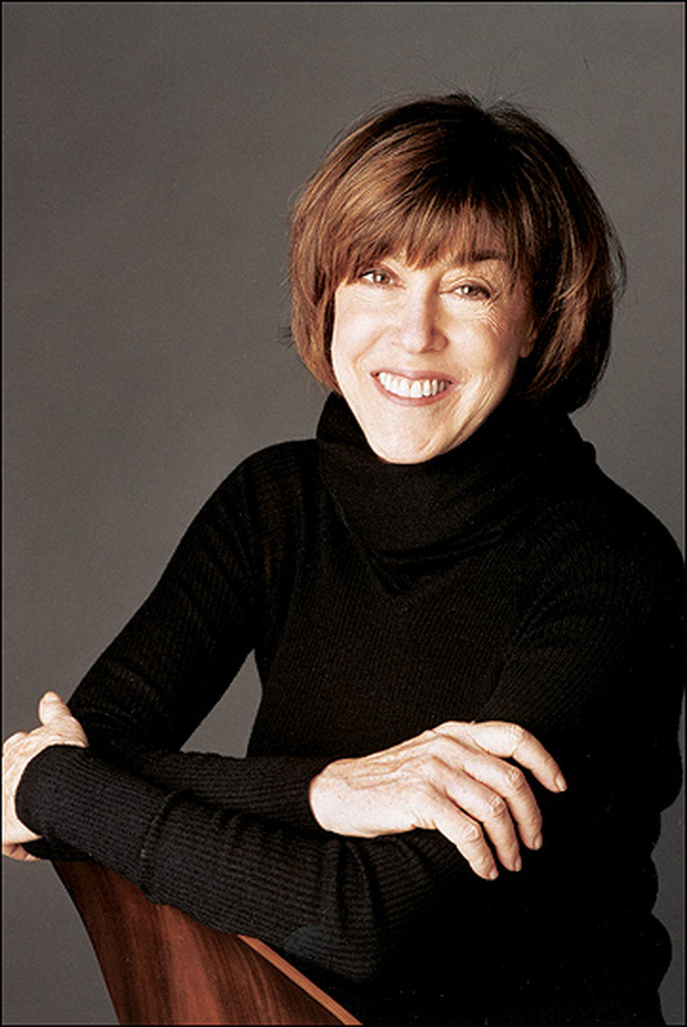 Nora Ephron in a black turtleneck sweater.