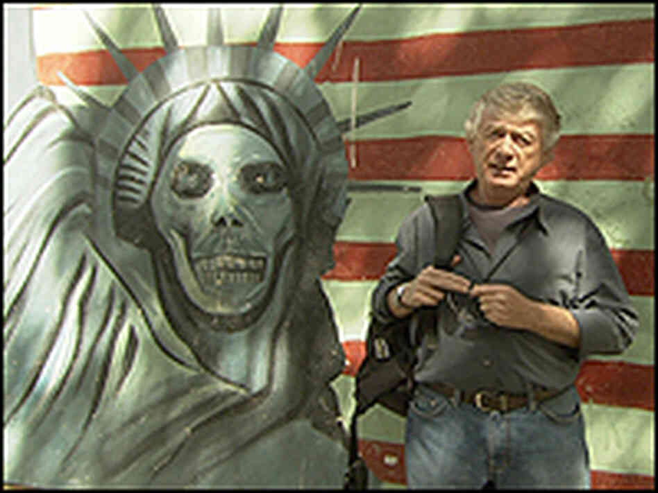 Koppel in front of the former U.S. Embassy Wall in Tehran.