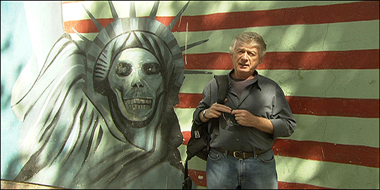 Koppel in front of the former U.S. Embassy Wall in Tehran.