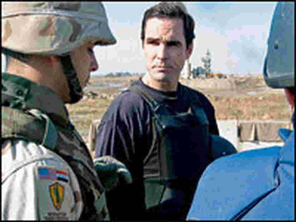 Woodruff standing with troops.