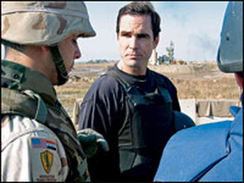 Woodruff standing with troops.