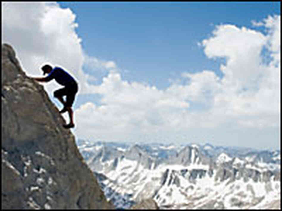 Mountain climber high on snowy peak. Mountain climber high on snowy peak.