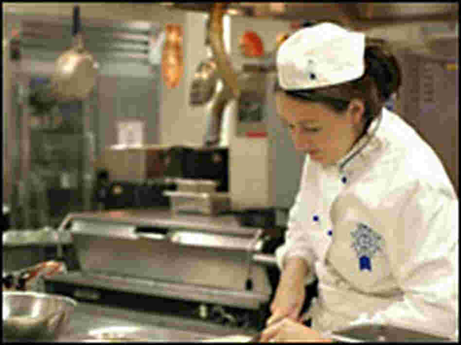 Chef Kathleen Flinn works in the kitchen. Chef Kathleen Flinn works in the kitchen.