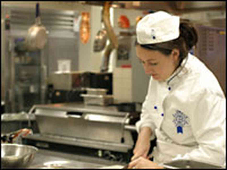 Chef Kathleen Flinn works in the kitchen. Chef Kathleen Flinn works in the kitchen.