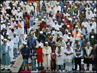 A large crowd of Muslim men take part in a special morning prayer in Dhaka, Bangladesh
