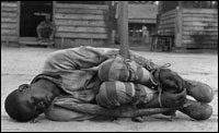 A young man is punished in a forced labor camp in Georgia in the 1930s.