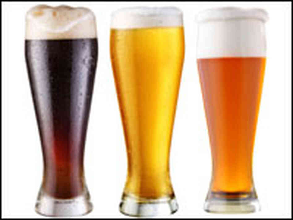 Three tall glasses of beer. Three tall glasses of beer.
