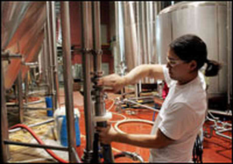 A worker at the Goose Island Brewery in Chicago prepares a fermenting vessel