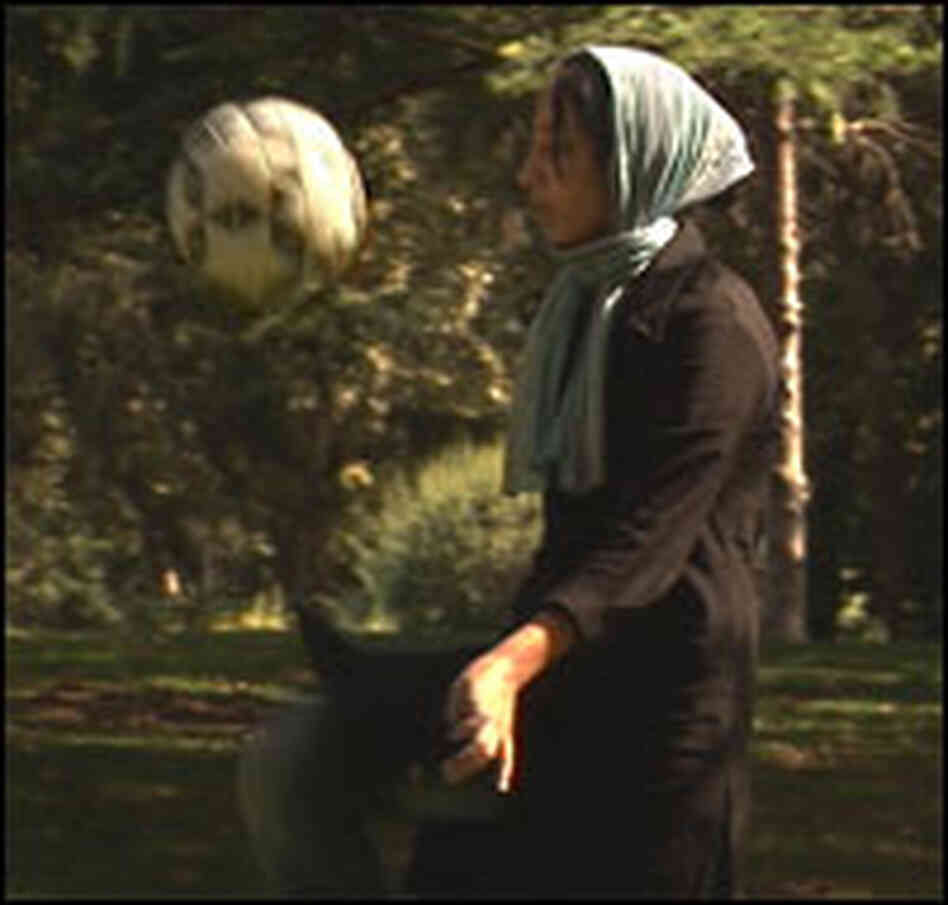 Iranian footballer practices her soccer moves. Iranian footballer practices her soccer moves.