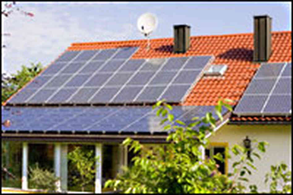 House with solar panels on the roof House with solar panels on the roof