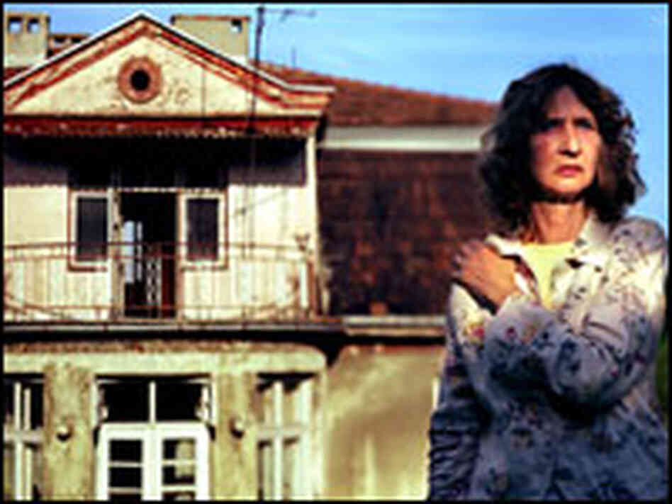 Monika Hertwig stands at the villa at the Plaszow Concentration Camp.