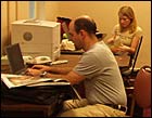 Host Peter Sagal and Director Amanda Gibson check out the script in the production office.