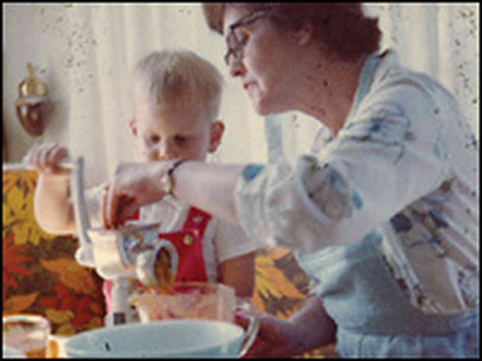 A young Alton Brown cooking with his grandmother. A young Alton Brown cooking with his grandmother.