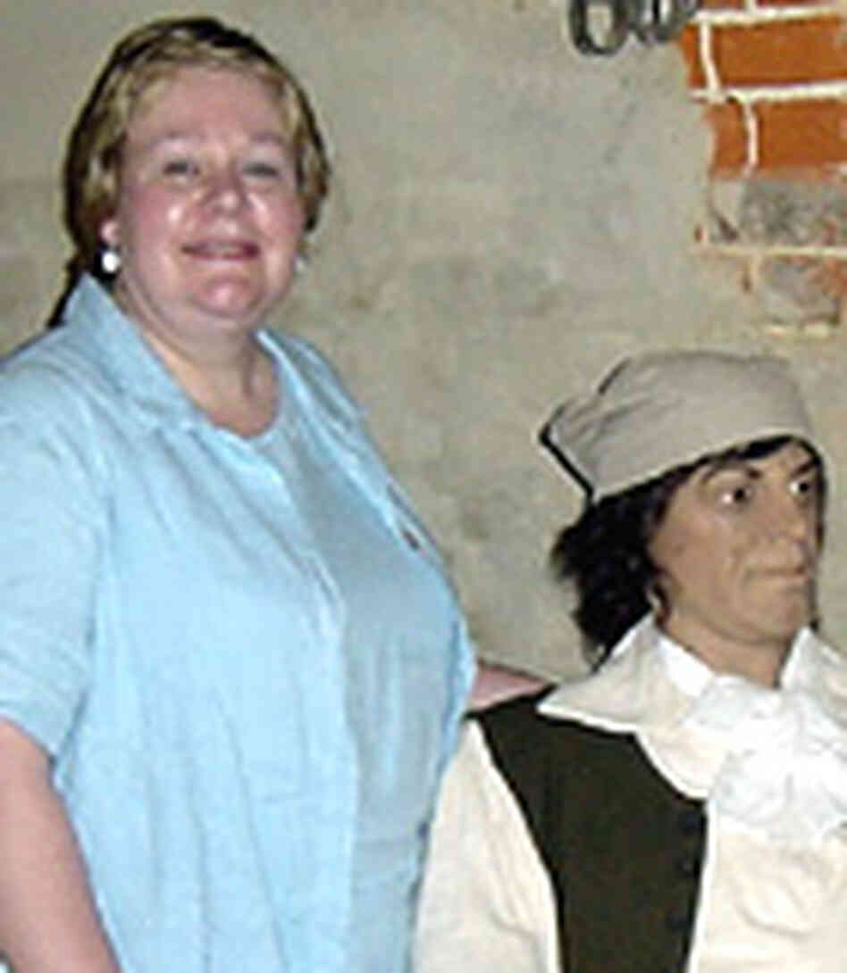 Carol Carman, a descendant of a convict servant with a mannequin of an indentured servant in the Wil Carol Carman, a descendant of a convict servant with a mannequin of an indentured servant in the Wil