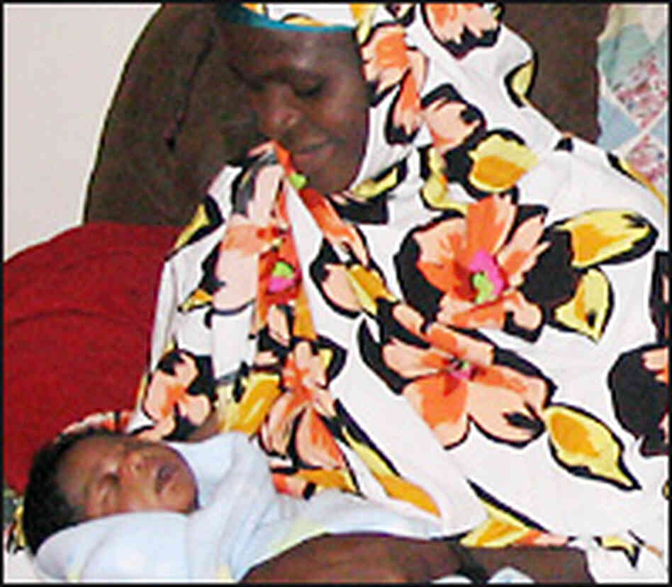 Rukiya Sheygo holds her newborn baby, Abukar. Rukiya Sheygo holds her newborn baby, Abukar.