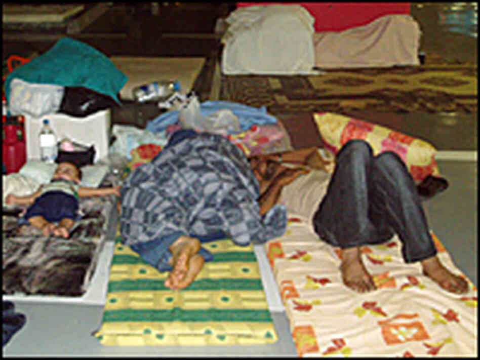 Lebanese families have slept for weeks in the parking spots of an underground garage. Lebanese families have slept for weeks in the parking spots of an underground garage.