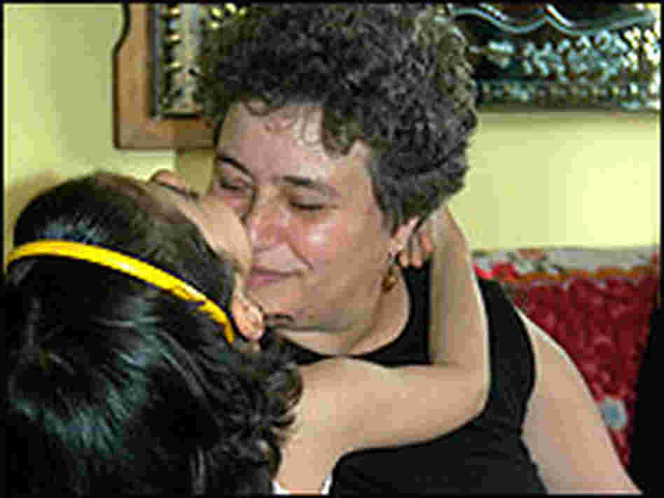 A Romanian child plays with her foster mother. A Romanian child plays with her foster mother.