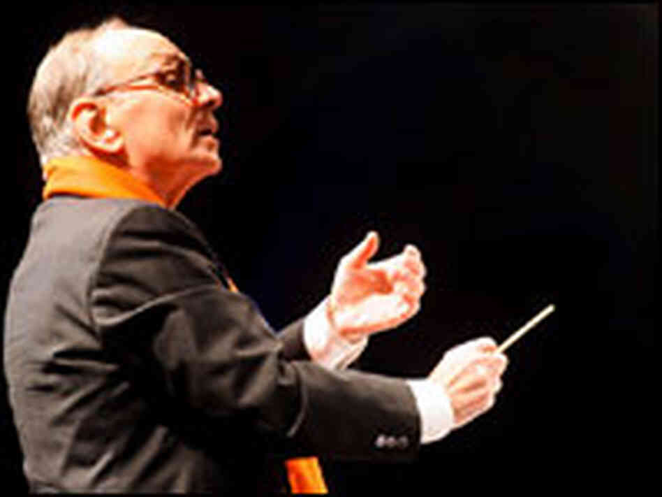 Composer Ennio Morricone conducts the Sinfonietta Orchestra in Milan, Dec. 16, 2006.