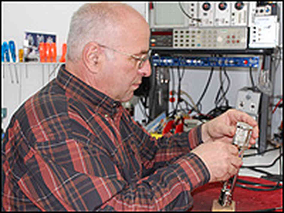 John Peluso works on a circuit board.